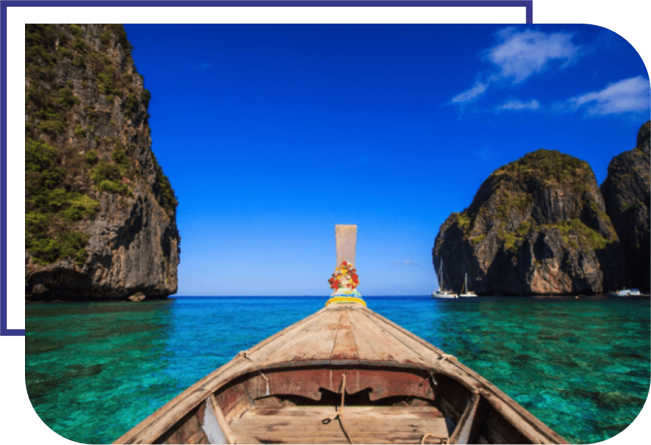 A woman is on the bow of a boat in the ocean.