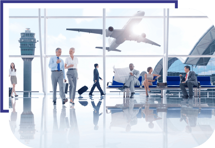 A group of people walking around an airport.