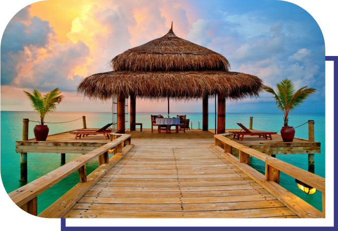 A wooden pier with an umbrella over it.