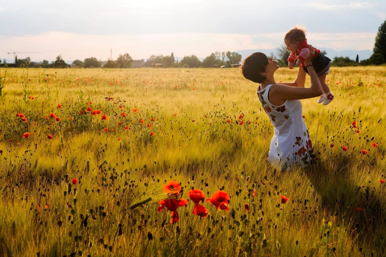 A woman holding a child in her arms.